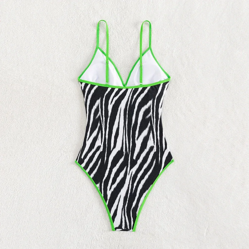 Zebra Print Plunging One-Piece Swimwear for Women with Vibrant Green Binding