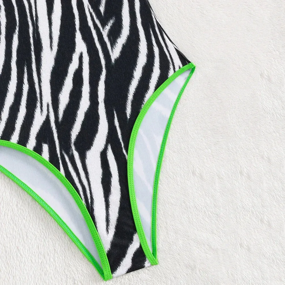 Zebra Print Plunging One-Piece Swimwear for Women with Vibrant Green Binding