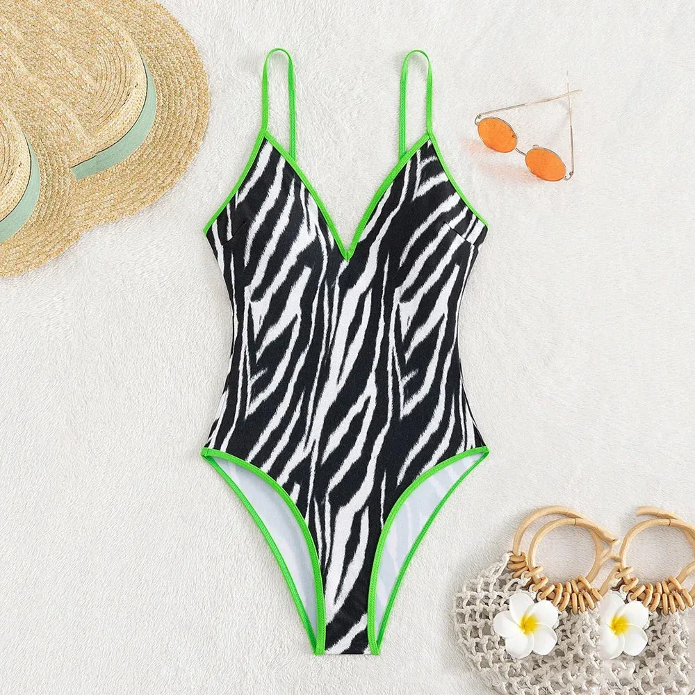Zebra Print Plunging One-Piece Swimwear for Women with Vibrant Green Binding
